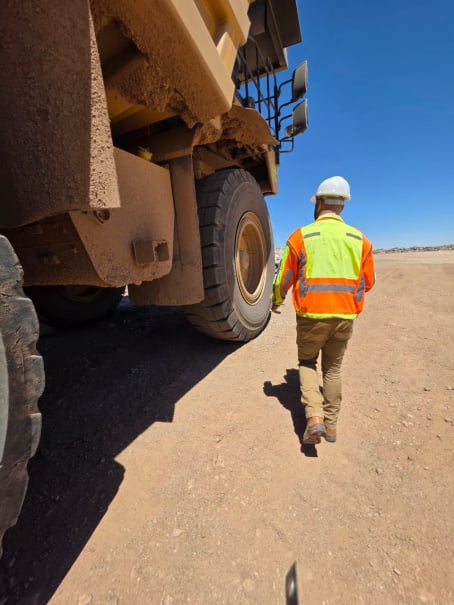 Technician fitting OTR tyre